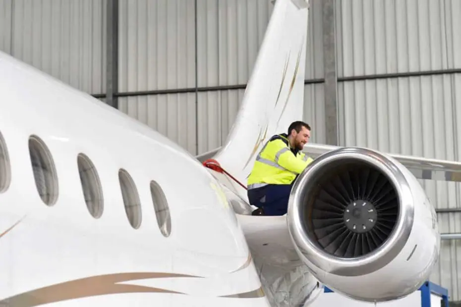 Technician inspecting an aircraft engine for corrosion