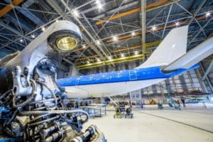 Commercial aircraft in hangar for maintenance, repair, and overhaul service.