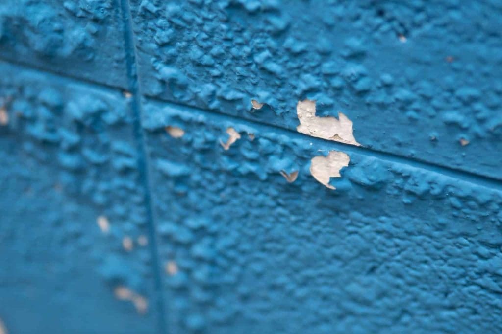 Wall with paint bubbling and peeling off