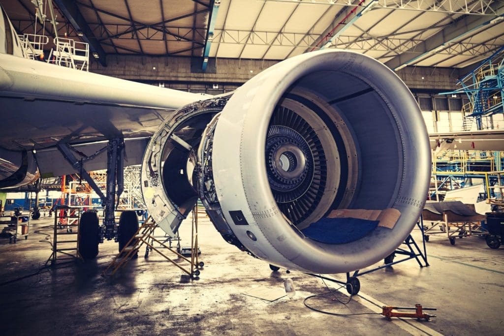 Commercial aircraft in hangar for cold spray repair